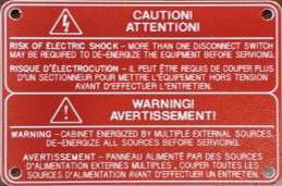 warning plate engraved on red plastic