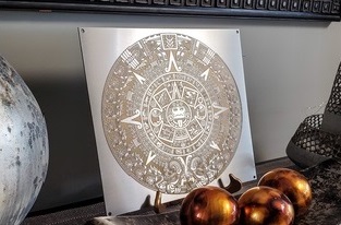 Mayan calendar painted with gold paint